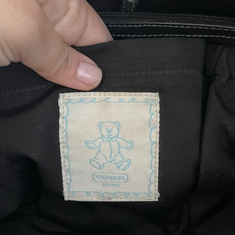 Timeless Signature Coach Monogram Baby Bag in Black
